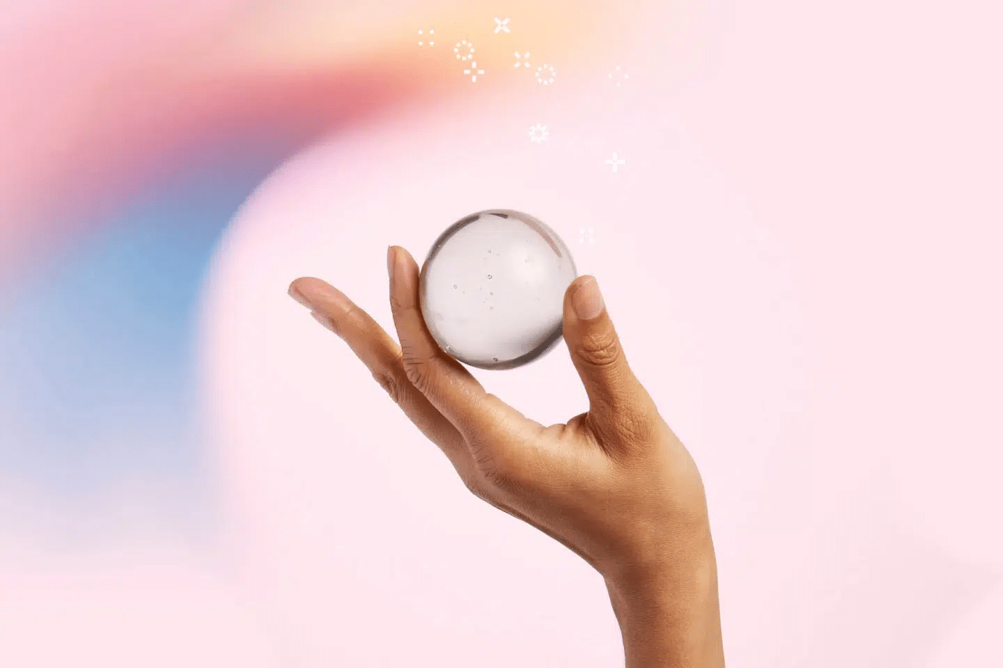 A hand holding a crystal ball